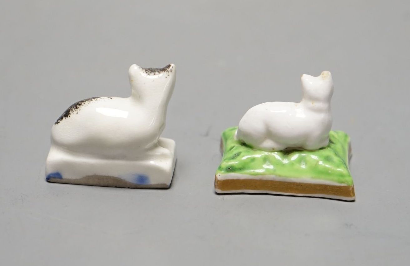 A rare Chamberlain Worcester model of a recumbent kitten, c.1820–40 and a Staffordshire porcelain model of a recumbent kitten, c.1830–50 (2). Cf. Dennis G Rice, Cats in English porcelain, colour plate 29 for the same Cha